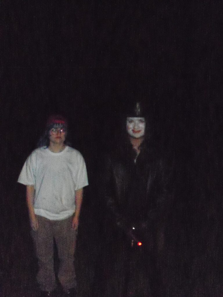 A Fred Durst and mobster clown costume duo